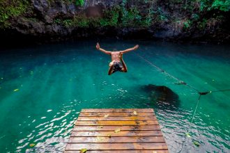 An image of a man diving in water