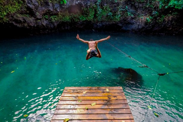 An image of a man diving in water