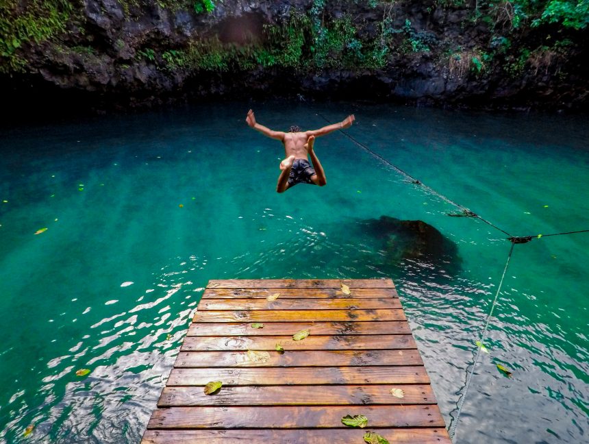 An image of a man diving in water
