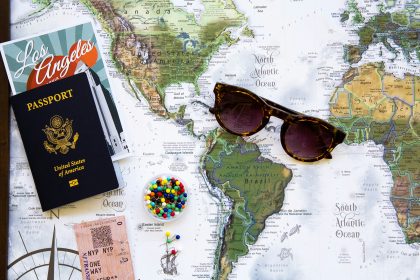 An image of a map with passport and glasses