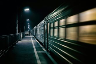 An image of a train at night