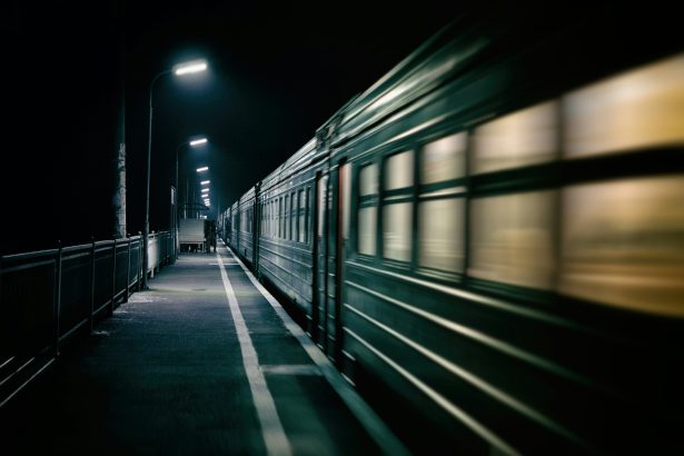An image of a train at night