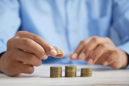 An image of a man counting coins